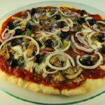 Discover Pizza Pugliese: Onions & Olives Delight Unveiled