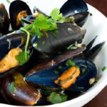 Aromatic Steamed Mussels Infused with Thai Herbs Delight